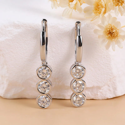 https://javiergems.com/products/925-sterling-silver-vvs1-moissanite-triple-diamonds-earrings™